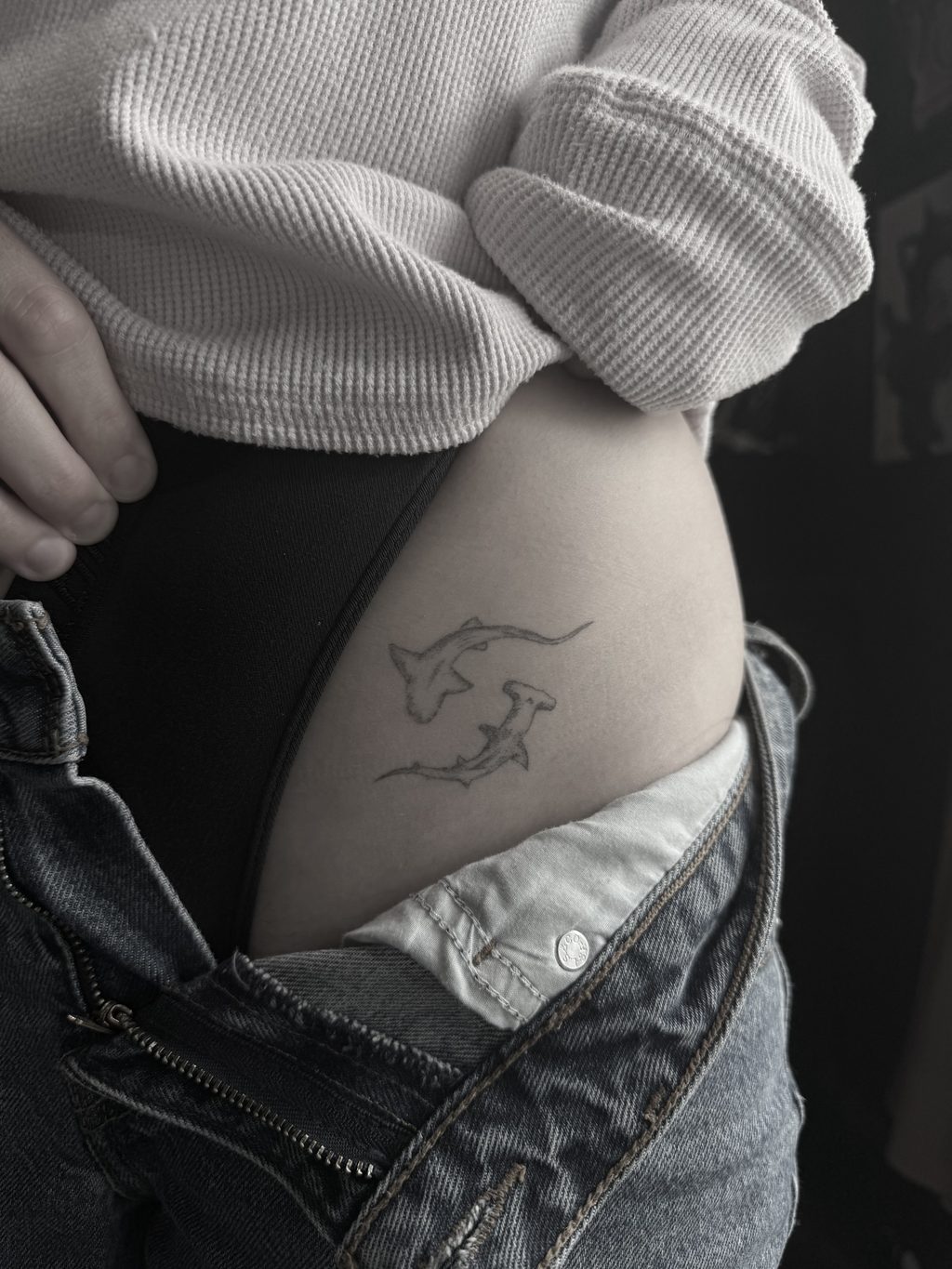 Fine-line single-needle hammerhead shark tattoo.